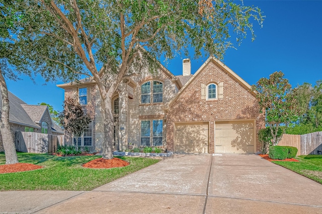 view of front of house featuring a front yard and a garage