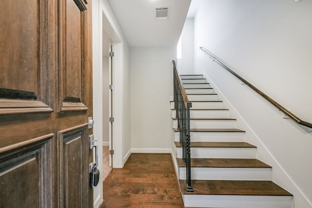 stairway with wood-type flooring