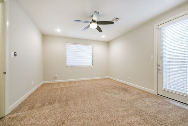 carpeted empty room with ceiling fan