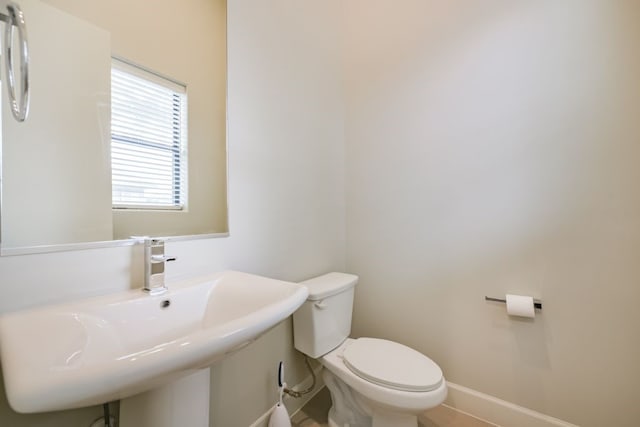 bathroom with toilet and sink