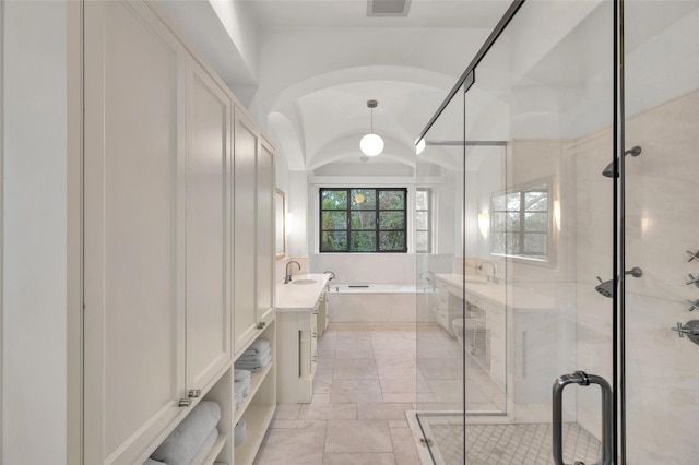 bathroom with vanity and independent shower and bath