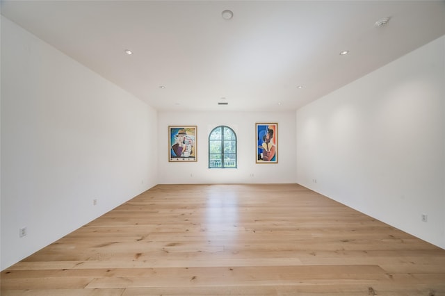 empty room with light hardwood / wood-style flooring