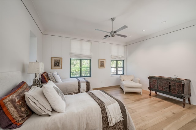 bedroom featuring ceiling fan and light hardwood / wood-style floors