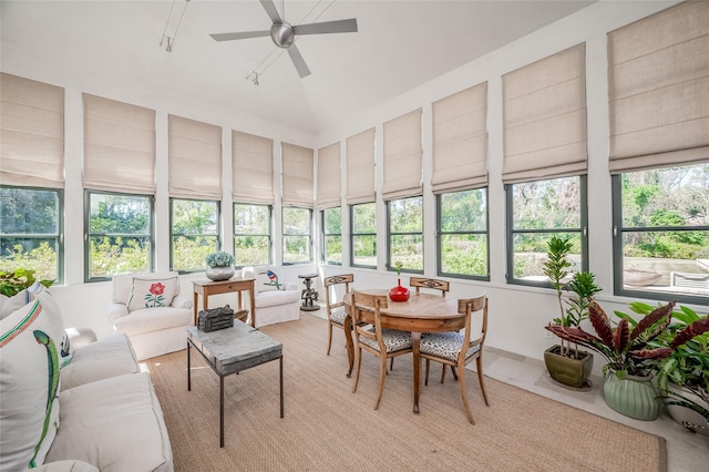 sunroom with ceiling fan and lofted ceiling