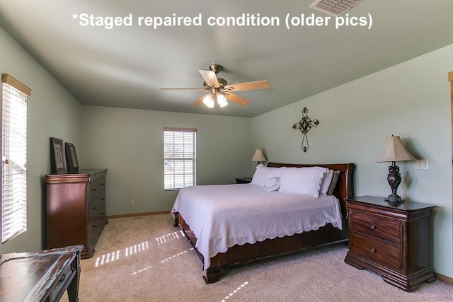 bedroom featuring a ceiling fan, baseboards, visible vents, and carpet flooring