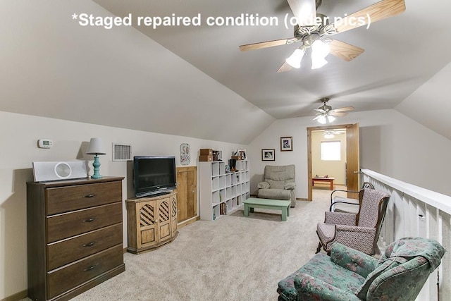 living area with lofted ceiling, light colored carpet, and ceiling fan