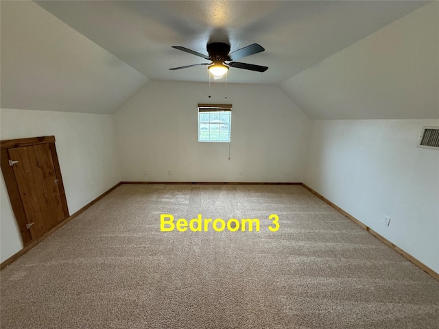 bonus room with ceiling fan, carpet, and lofted ceiling