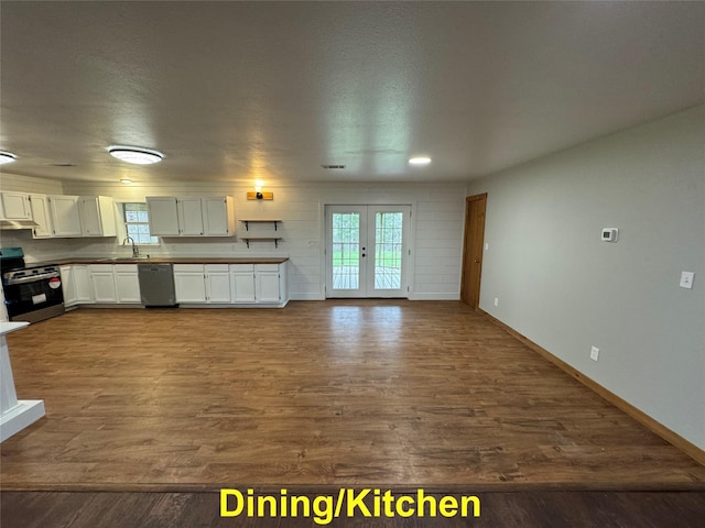 kitchen featuring stainless steel appliances, french doors, hardwood / wood-style floors, sink, and white cabinetry