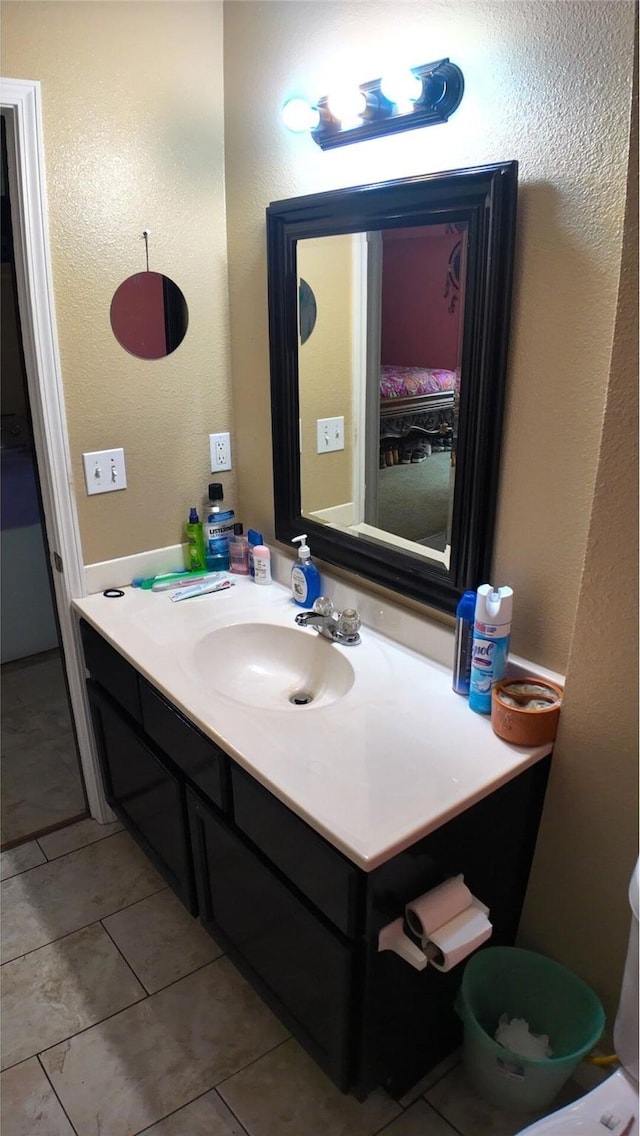 bathroom with tile patterned flooring and vanity