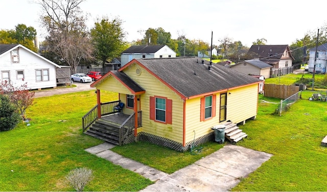 back of house with a yard