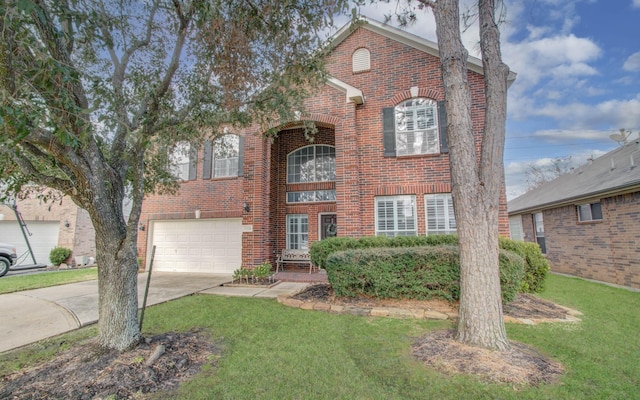 view of property featuring a garage and a front lawn