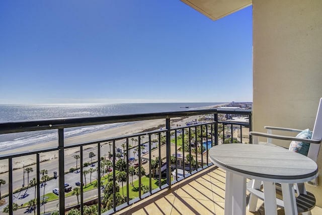 balcony with a beach view and a water view