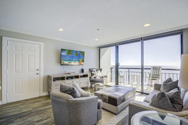 living room featuring floor to ceiling windows, crown molding, and dark hardwood / wood-style floors