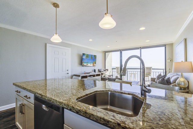 kitchen with dishwasher, pendant lighting, light stone countertops, and sink