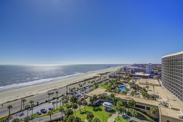 birds eye view of property featuring a water view and a view of the beach