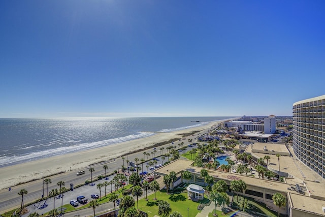 drone / aerial view with a water view and a beach view