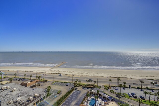 aerial view featuring a water view and a beach view