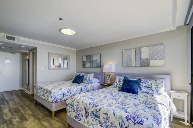 bedroom featuring dark hardwood / wood-style flooring and ornamental molding