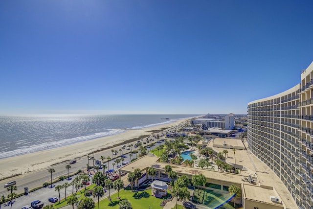 bird's eye view featuring a water view and a beach view