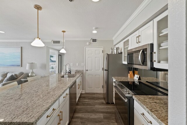 5220 Seawall Blvd Unit 1536/37, Galveston, TX 77551 - kitchen with appliances with stainless steel finishes, white cabinets, ornamental molding, glass insert cabinets, and dark wood-style floors