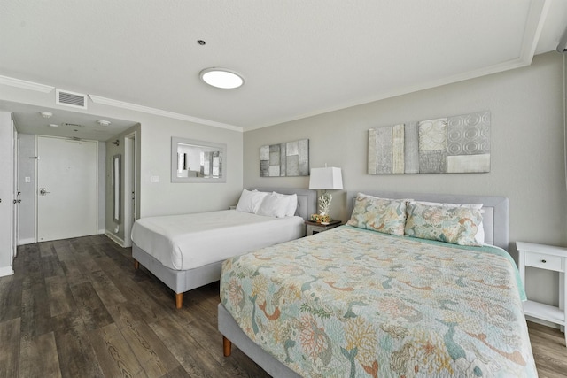 5220 Seawall Blvd Unit 1536/37, Galveston, TX 77551 - bedroom with ornamental molding and dark wood-style floors