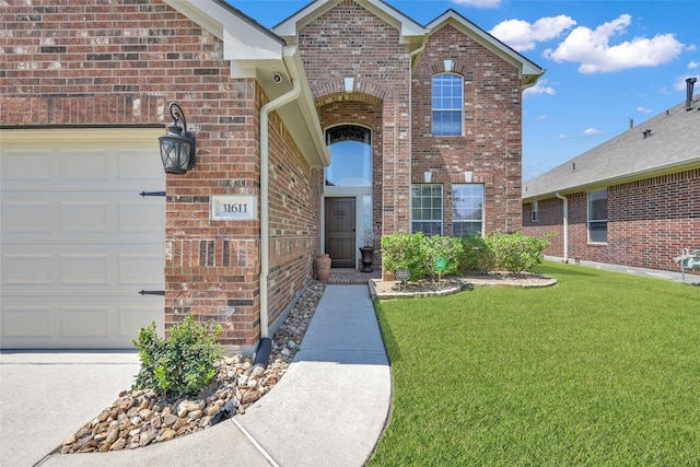 view of front facade with a front yard and a garage