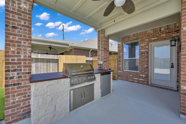 view of patio / terrace featuring ceiling fan, grilling area, and exterior kitchen