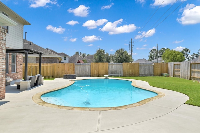 view of swimming pool featuring a lawn and a patio