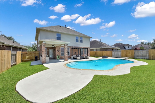 view of pool featuring a lawn, ceiling fan, outdoor lounge area, and a patio