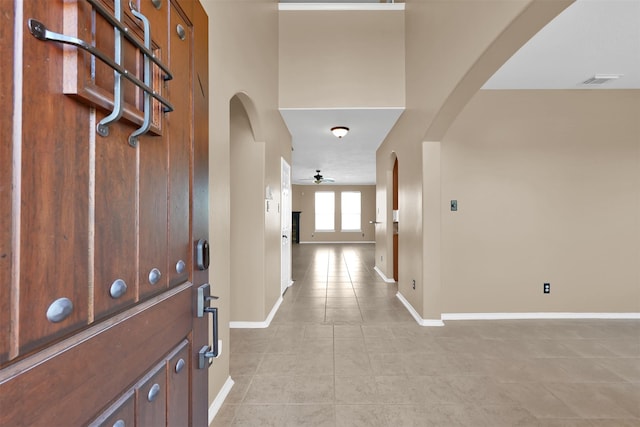 hallway featuring light tile patterned floors