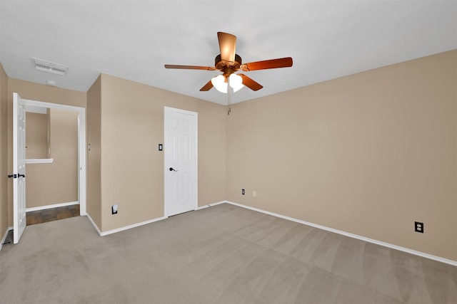 empty room with light carpet and ceiling fan