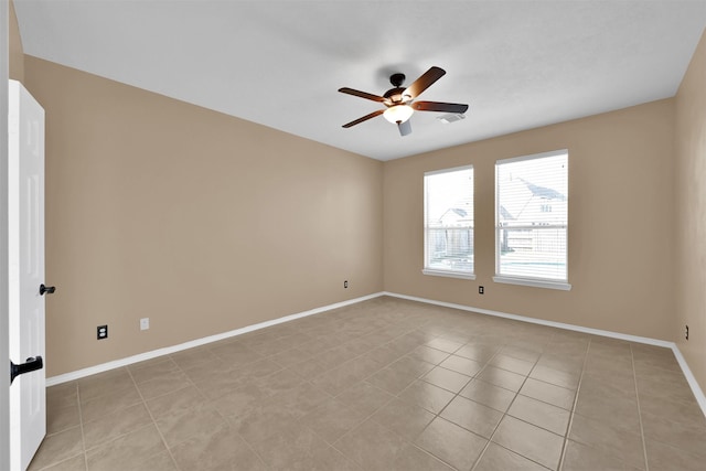 unfurnished room featuring ceiling fan and light tile patterned floors