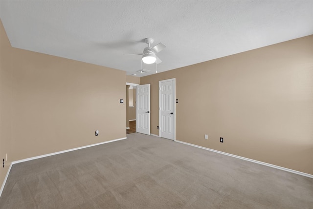 empty room with carpet and ceiling fan