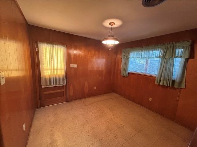 6402 Jim St, Houston, TX 77092 - spare room with wood walls and light flooring