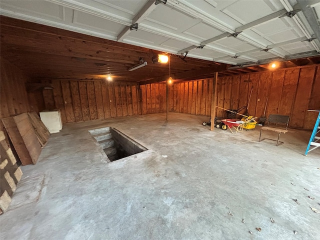 6402 Jim St, Houston, TX 77092 - garage featuring a garage door opener and wooden walls