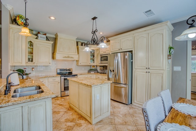 kitchen with sink, hanging light fixtures, appliances with stainless steel finishes, a kitchen island, and custom exhaust hood