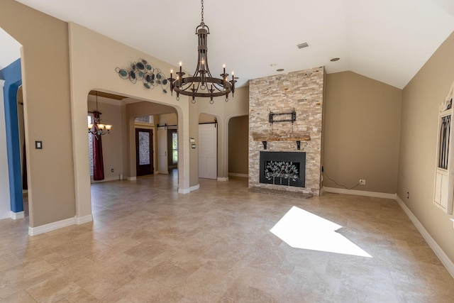 unfurnished living room featuring a notable chandelier and a fireplace