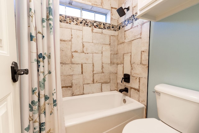 bathroom featuring toilet and shower / tub combo