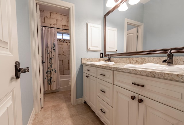 bathroom featuring vanity and shower / bath combo with shower curtain