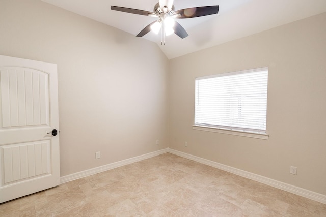 spare room featuring ceiling fan and lofted ceiling