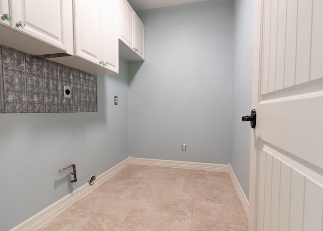 laundry room featuring cabinets, hookup for a gas dryer, and electric dryer hookup