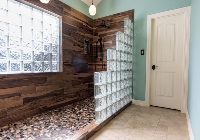 bathroom with tile patterned flooring and walk in shower