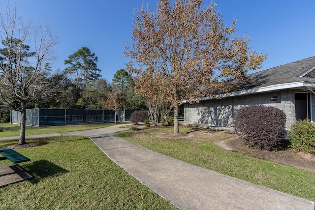 view of home's community featuring a lawn