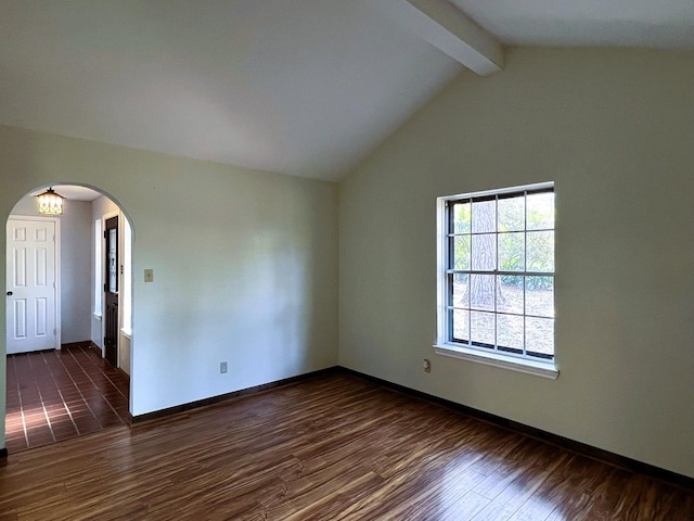 unfurnished room featuring vaulted ceiling with beams and dark wood-type flooring