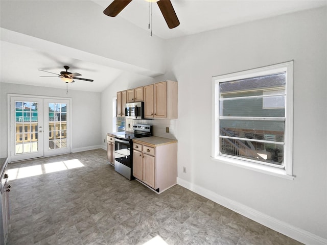 kitchen with ceiling fan, french doors, light brown cabinets, stainless steel appliances, and vaulted ceiling