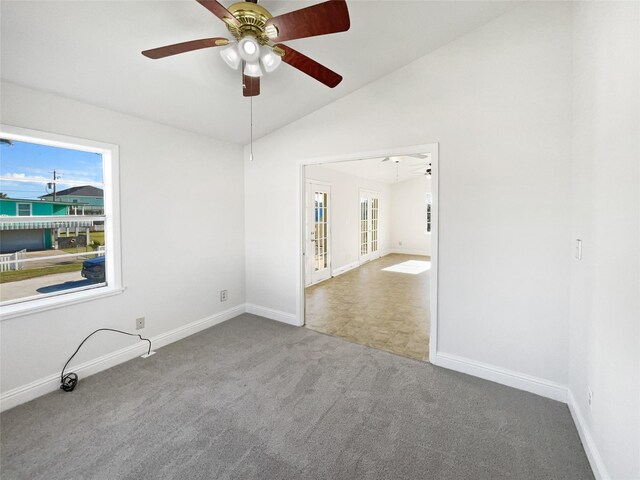 unfurnished room with carpet flooring, ceiling fan, and lofted ceiling