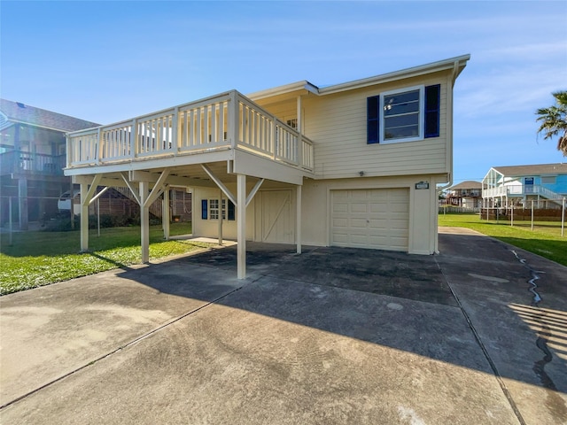 exterior space featuring a lawn and a garage