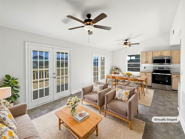 living room featuring french doors, plenty of natural light, and ceiling fan