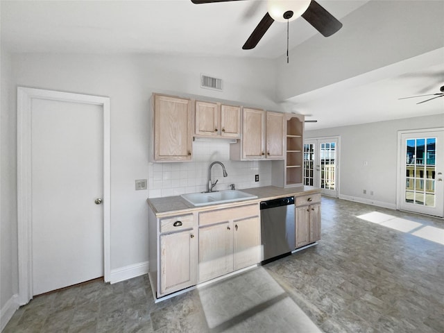 kitchen featuring dishwasher, sink, backsplash, lofted ceiling, and light brown cabinetry