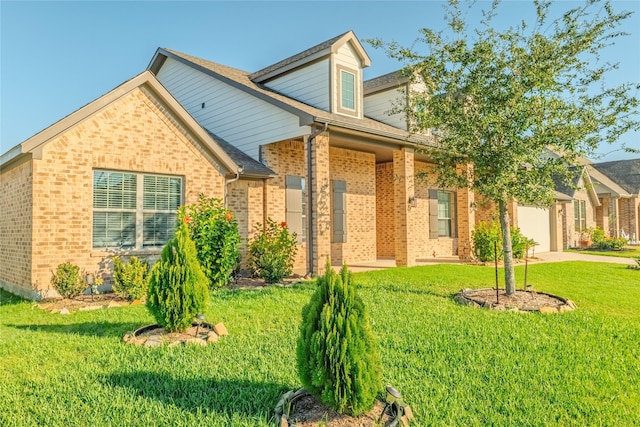 view of front facade featuring a front yard and a garage